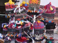 Bukhara - display of colourful hats - people actually wear these